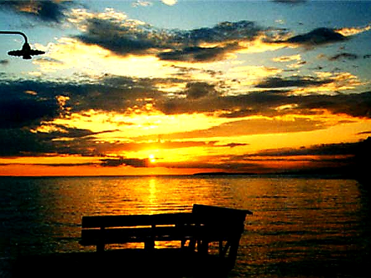 Bench silhouette at golden sunset, Lake Nipissing